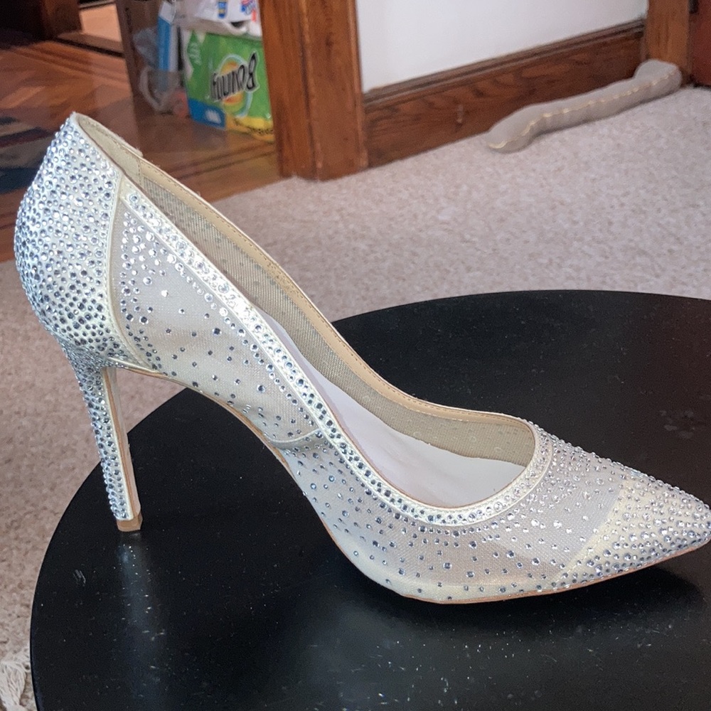 Badgley Mischka heels. Never worn. Comes with box,duster bag and extra crystals.